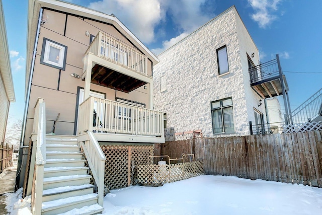 2432 W Ohio St, Chicago, IL 60612 - snow covered house with fence and stairs