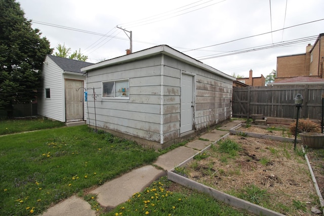 view of outdoor structure featuring a vegetable garden