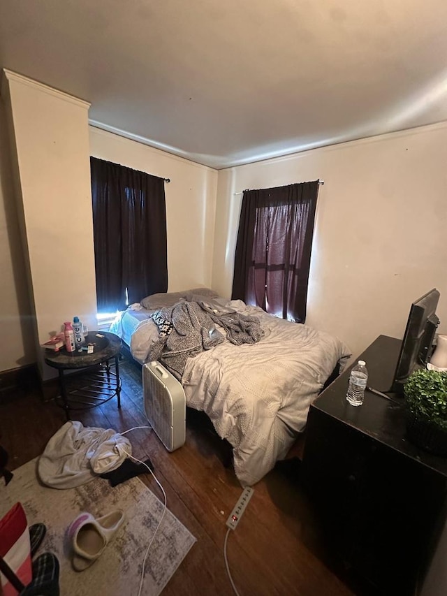bedroom with wood finished floors