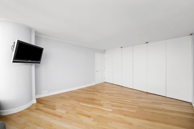 505 N Lake Shore Dr Unit 6304-6305, Chicago, IL 60611 - unfurnished living room with baseboards and light wood-style floors