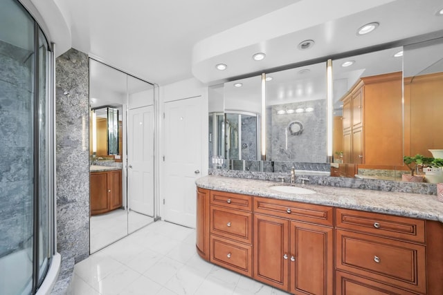 505 N Lake Shore Dr Unit 6304-6305, Chicago, IL 60611 - bathroom with vanity, a stall shower, and recessed lighting