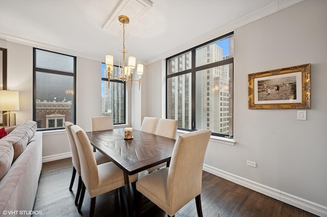 1122 N Dearborn St Unit 10A, Chicago, IL 60610 - dining room featuring wood finished floors, baseboards, ornamental molding, and a notable chandelier
