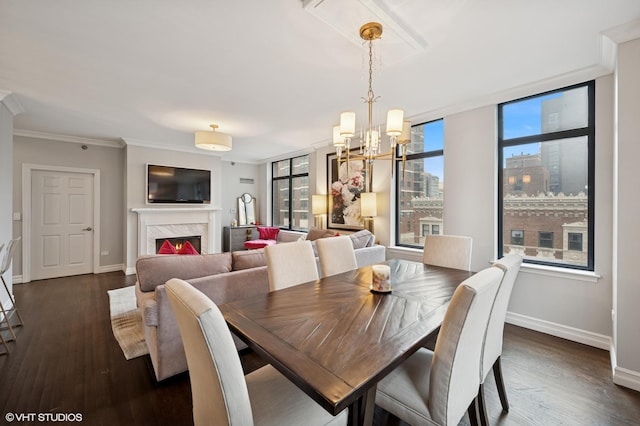 1122 N Dearborn St Unit 10A, Chicago, IL 60610 - dining space featuring ornamental molding, dark wood finished floors, an inviting chandelier, a premium fireplace, and baseboards