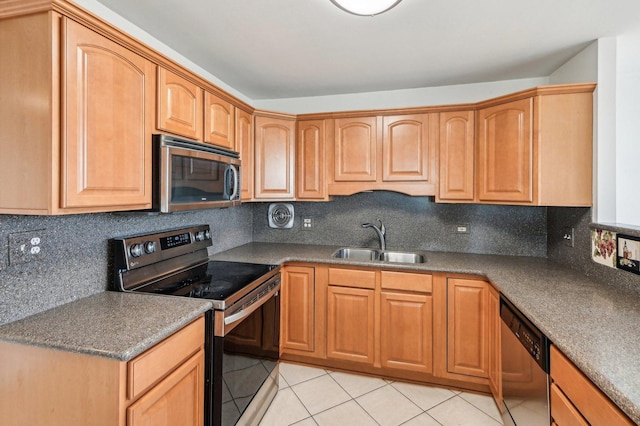 101 Bar Harbour Rd Unit 6N, Schaumburg, IL 60193 - kitchen featuring appliances with stainless steel finishes, a sink, light tile patterned flooring, and decorative backsplash
