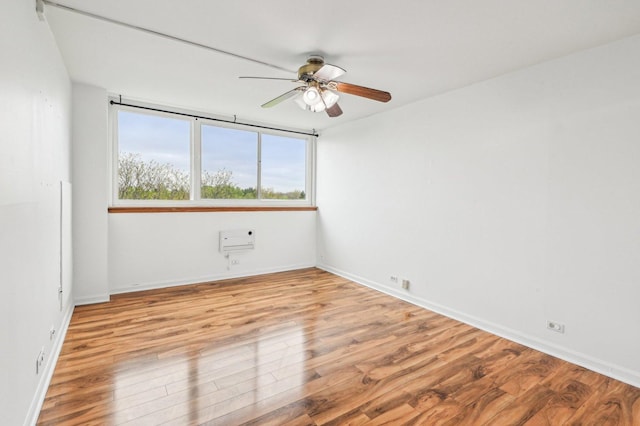 101 Bar Harbour Rd Unit 6N, Schaumburg, IL 60193 - empty room featuring a ceiling fan, baseboards, and light wood finished floors
