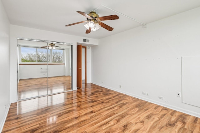 101 Bar Harbour Rd Unit 6N, Schaumburg, IL 60193 - empty room featuring a ceiling fan, wood finished floors, and baseboards