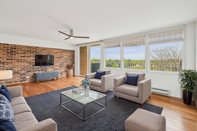 101 Bar Harbour Rd Unit 6N, Schaumburg, IL 60193 - living area with a baseboard radiator, wood finished floors, a ceiling fan, and brick wall