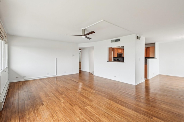 101 Bar Harbour Rd Unit 6N, Schaumburg, IL 60193 - unfurnished living room with light wood finished floors, visible vents, baseboards, and a ceiling fan