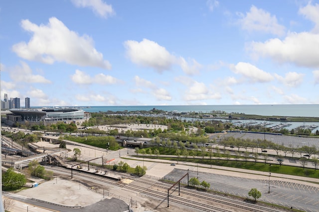 view of urban area featuring a nearby body of water and a major roadway