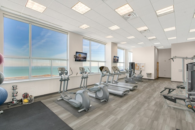 exercise room featuring carpet floors and baseboards