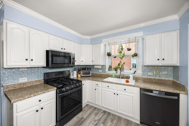 1612 Gardner Rd, Westchester, IL 60154 - kitchen with black range with gas cooktop, dishwasher, a sink, ornamental molding, and white cabinetry