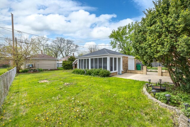 1612 Gardner Rd, Westchester, IL 60154 - rear view of house with a sunroom and a patio