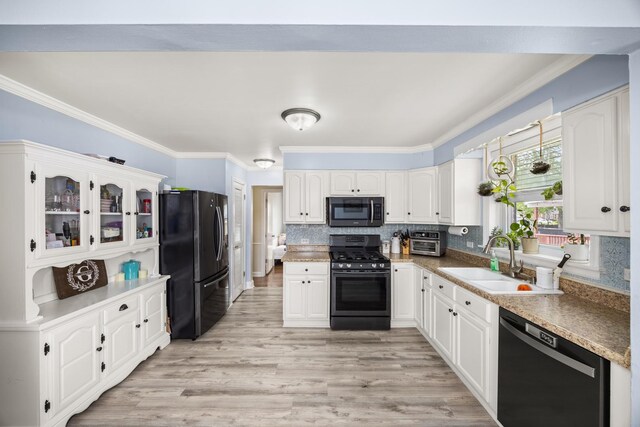 1612 Gardner Rd, Westchester, IL 60154 - kitchen with black appliances, a sink, ornamental molding, light wood finished floors, and white cabinets
