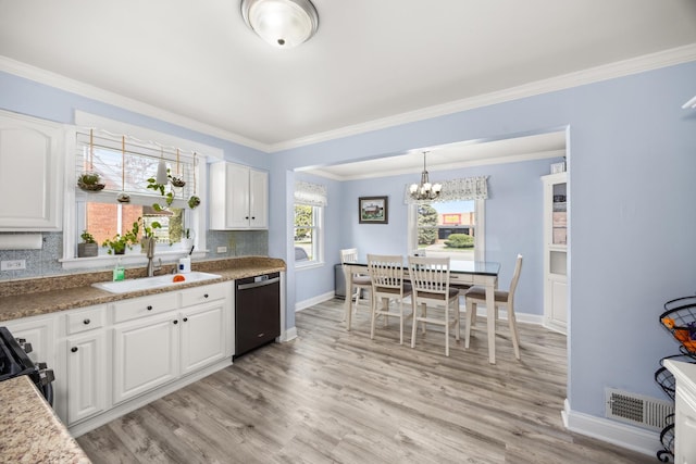 1612 Gardner Rd, Westchester, IL 60154 - kitchen with dishwashing machine, a sink, baseboards, a chandelier, and light wood finished floors