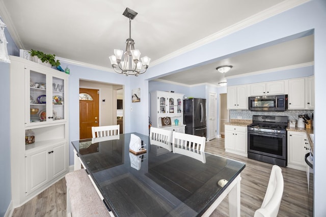 1612 Gardner Rd, Westchester, IL 60154 - dining space with a chandelier, light wood-style floors, and ornamental molding