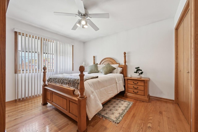 2740 W 35th Pl, Chicago, IL 60632 - bedroom with light wood-style flooring, baseboards, a closet, and ceiling fan