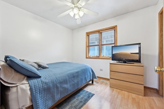 2740 W 35th Pl, Chicago, IL 60632 - bedroom featuring baseboards, light wood-style floors, and ceiling fan