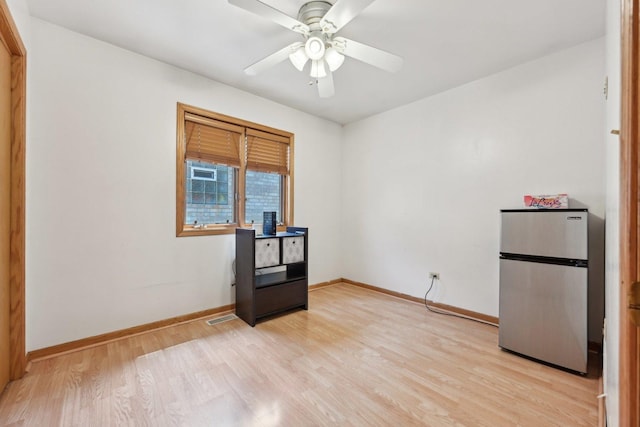 2740 W 35th Pl, Chicago, IL 60632 - unfurnished room featuring light wood-type flooring, baseboards, and a ceiling fan