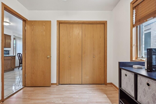 2740 W 35th Pl, Chicago, IL 60632 - unfurnished bedroom with light wood-type flooring, a closet, and baseboards
