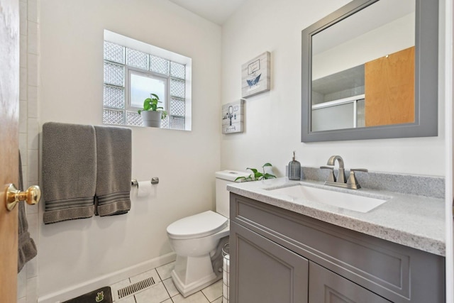 2740 W 35th Pl, Chicago, IL 60632 - bathroom with toilet, tile patterned flooring, a shower with shower door, vanity, and baseboards