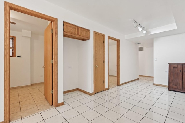 2740 W 35th Pl, Chicago, IL 60632 - spare room featuring light tile patterned flooring, rail lighting, and baseboards