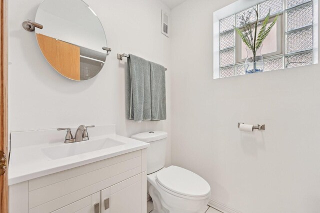 2740 W 35th Pl, Chicago, IL 60632 - bathroom featuring toilet, vanity, and baseboards