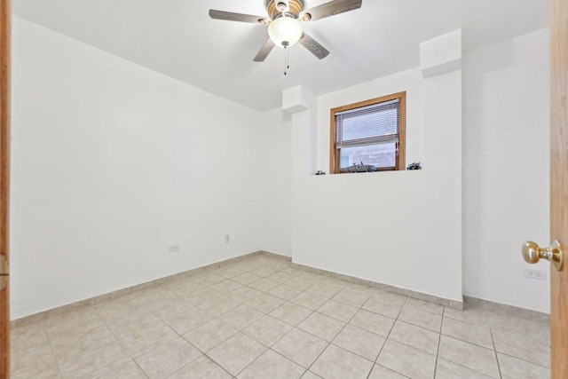 2740 W 35th Pl, Chicago, IL 60632 - empty room featuring a ceiling fan, light tile patterned floors, and baseboards