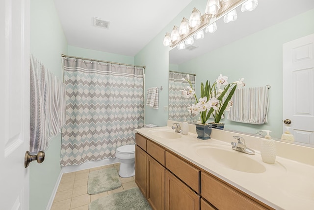 536 W Caldwell Dr, Round Lake, IL 60073 - bathroom with a sink, tile patterned flooring, toilet, and visible vents