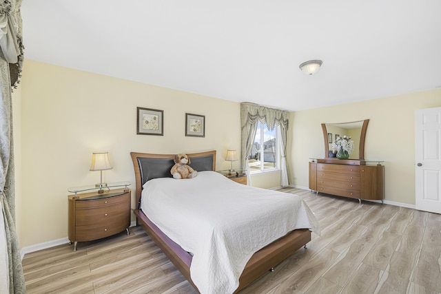 536 W Caldwell Dr, Round Lake, IL 60073 - bedroom featuring light wood finished floors and baseboards