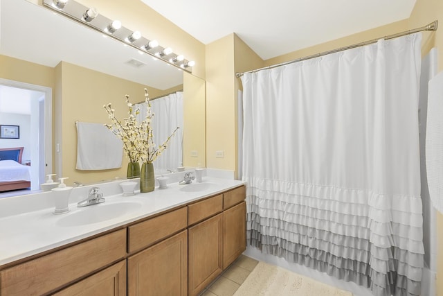 536 W Caldwell Dr, Round Lake, IL 60073 - ensuite bathroom with a sink, double vanity, visible vents, and tile patterned flooring