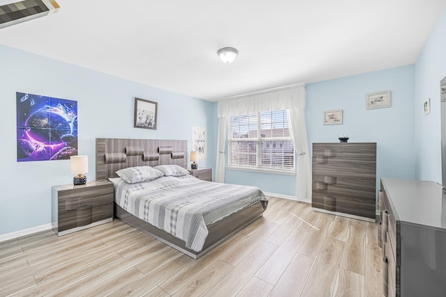 536 W Caldwell Dr, Round Lake, IL 60073 - bedroom featuring light wood-style flooring and baseboards