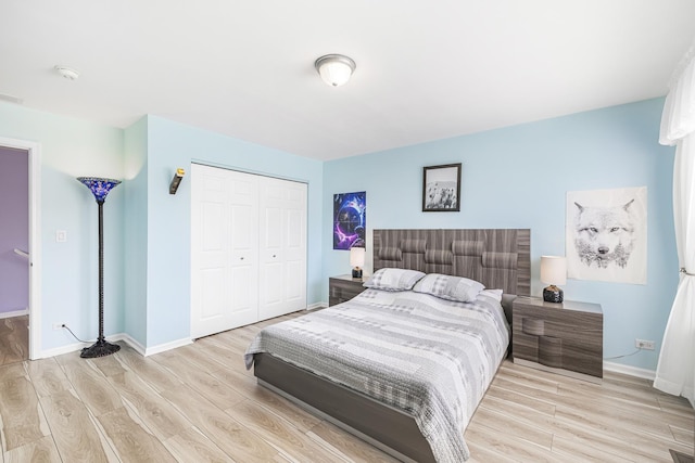 536 W Caldwell Dr, Round Lake, IL 60073 - bedroom featuring baseboards, a closet, and wood finished floors