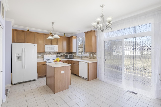 536 W Caldwell Dr, Round Lake, IL 60073 - kitchen featuring visible vents, white appliances, light countertops, a chandelier, and tasteful backsplash