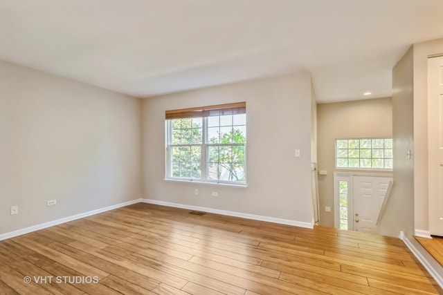 34309 N Goldenrod Rd, Round Lake, IL 60073 - unfurnished room with healthy amount of natural light, baseboards, wood-type flooring, and recessed lighting