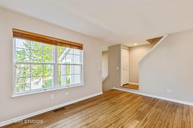 34309 N Goldenrod Rd, Round Lake, IL 60073 - unfurnished living room featuring light wood-style floors and baseboards