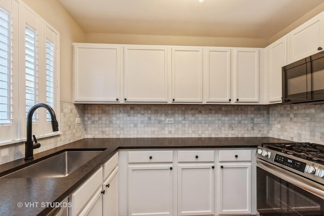 34309 N Goldenrod Rd, Round Lake, IL 60073 - kitchen featuring stainless steel gas stove, a sink, black microwave, and white cabinets