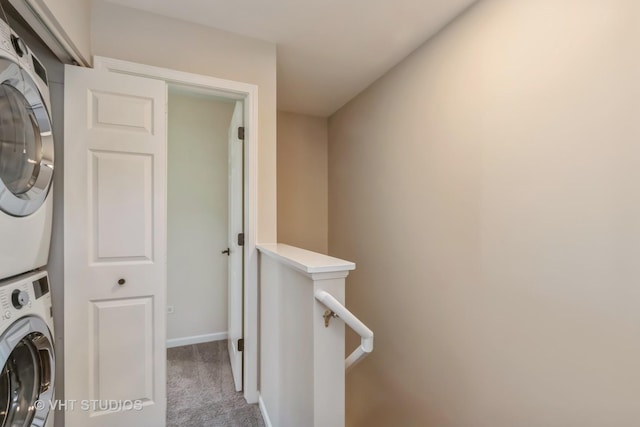 34309 N Goldenrod Rd, Round Lake, IL 60073 - clothes washing area with stacked washing machine and dryer, carpet floors, and baseboards