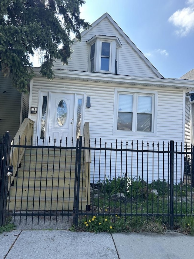 1122 N Mason Ave, Chicago, IL 60651 - view of front facade featuring a fenced front yard and a gate