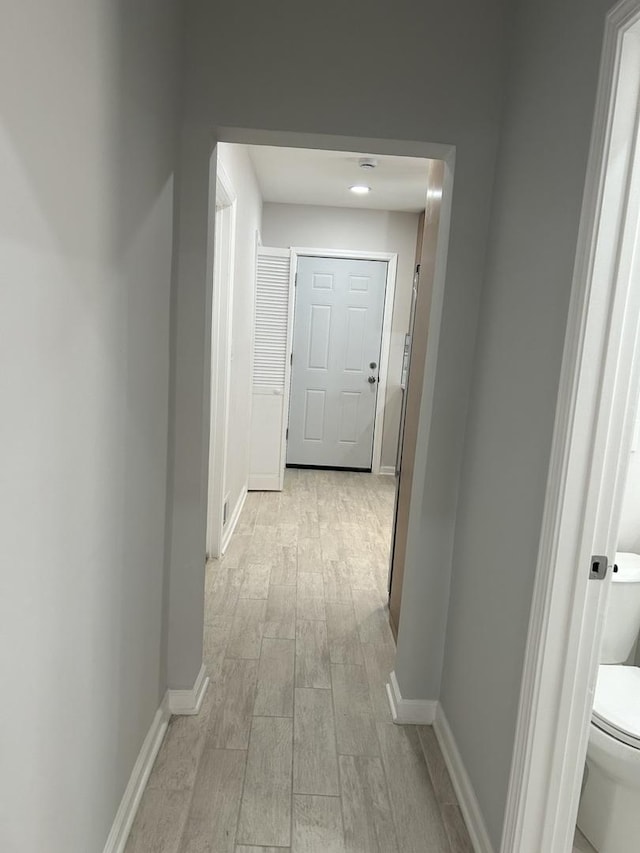 1122 N Mason Ave, Chicago, IL 60651 - corridor with light wood-type flooring and baseboards