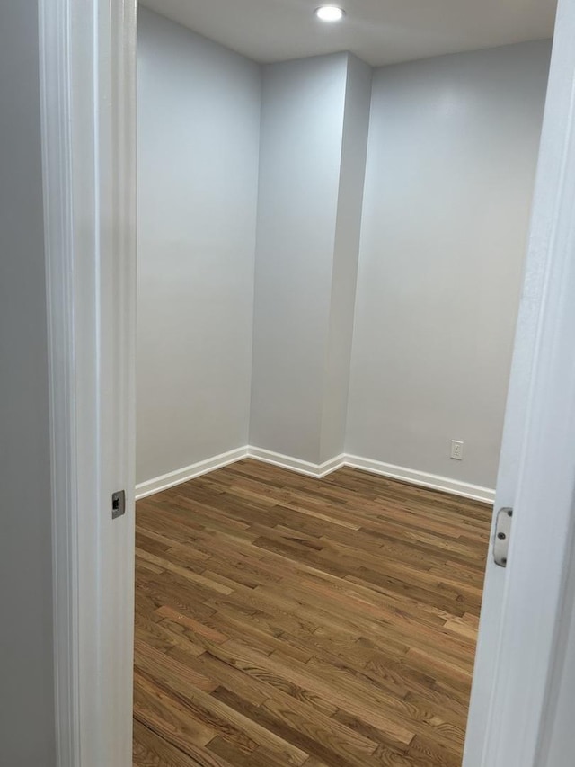 1122 N Mason Ave, Chicago, IL 60651 - spare room featuring dark wood-style floors, baseboards, and recessed lighting