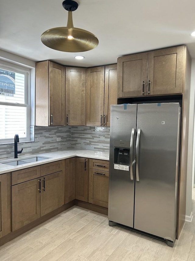1122 N Mason Ave, Chicago, IL 60651 - kitchen with stainless steel fridge with ice dispenser, a sink, tasteful backsplash, light countertops, and recessed lighting