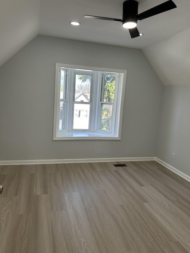 1122 N Mason Ave, Chicago, IL 60651 - bonus room featuring vaulted ceiling, a ceiling fan, wood finished floors, baseboards, and recessed lighting