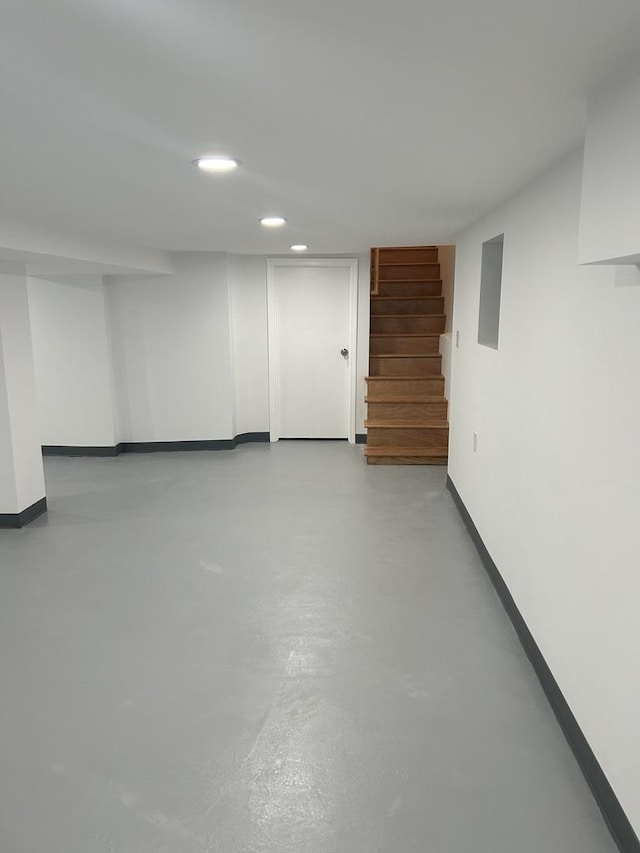 1122 N Mason Ave, Chicago, IL 60651 - finished below grade area featuring stairs, recessed lighting, and baseboards
