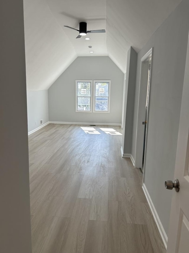 1122 N Mason Ave, Chicago, IL 60651 - bonus room with vaulted ceiling, ceiling fan, light wood finished floors, and baseboards