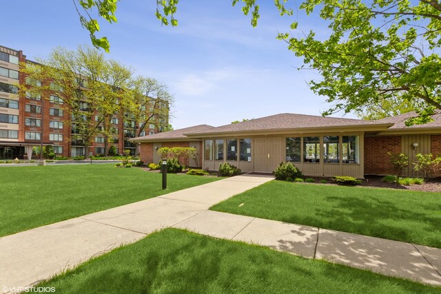 view of front of home with a front lawn