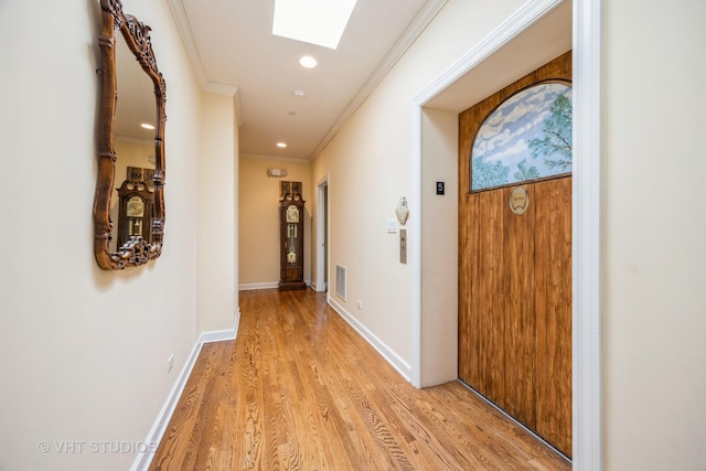 444 Ashland Ave Unit 5, River Forest, IL 60305 - hall with crown molding, a skylight, light wood-style flooring, recessed lighting, and baseboards