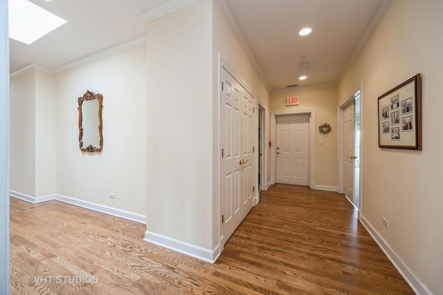444 Ashland Ave Unit 5, River Forest, IL 60305 - hallway with ornamental molding, wood finished floors, a skylight, baseboards, and recessed lighting