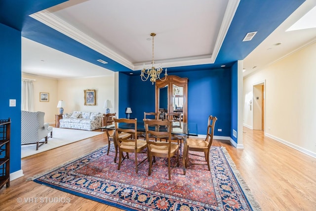 444 Ashland Ave Unit 5, River Forest, IL 60305 - dining room with a raised ceiling, wood finished floors, ornamental molding, a chandelier, and baseboards