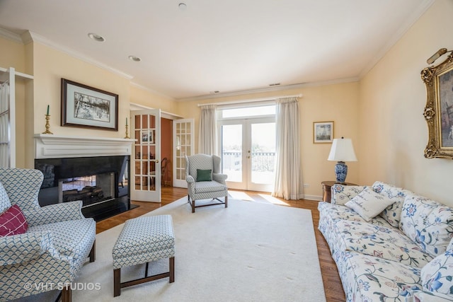 444 Ashland Ave Unit 5, River Forest, IL 60305 - living area featuring french doors, wood finished floors, ornamental molding, and a multi sided fireplace