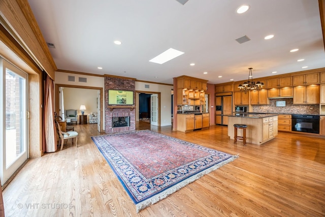 444 Ashland Ave Unit 5, River Forest, IL 60305 - living room with a brick fireplace, light wood-style floors, crown molding, a chandelier, and recessed lighting